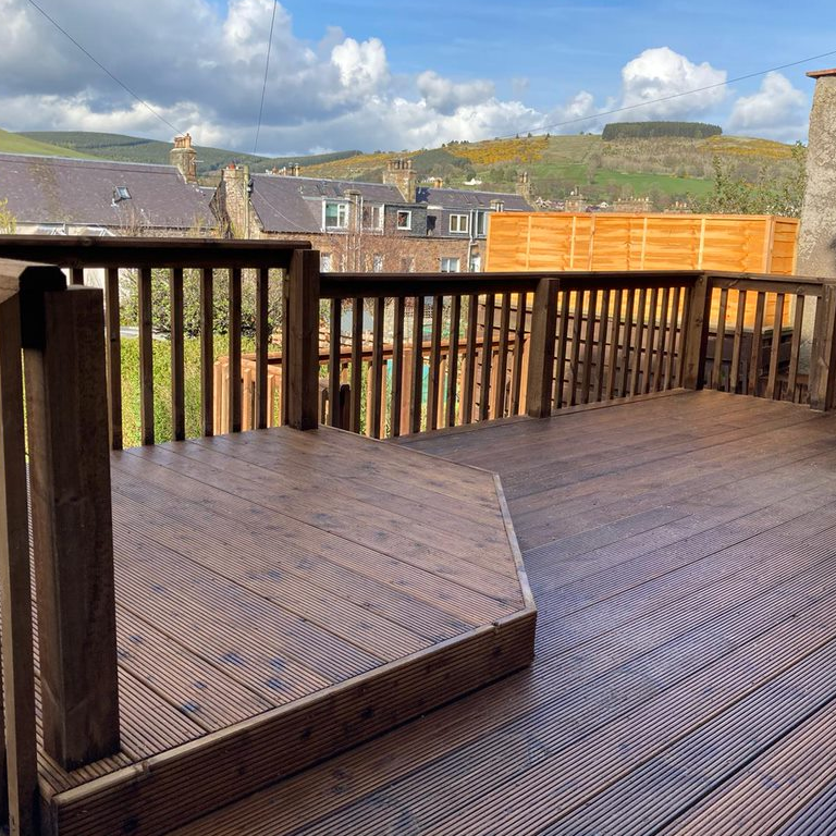 Enhance your home with our outdoor living solutions, including decking, garden rooms, and landscaping. Custom outdoor decking and living space in Glasgow by BSM Contracts